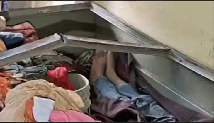 The body of a 13 year-old boy was found on a bed in a flat.